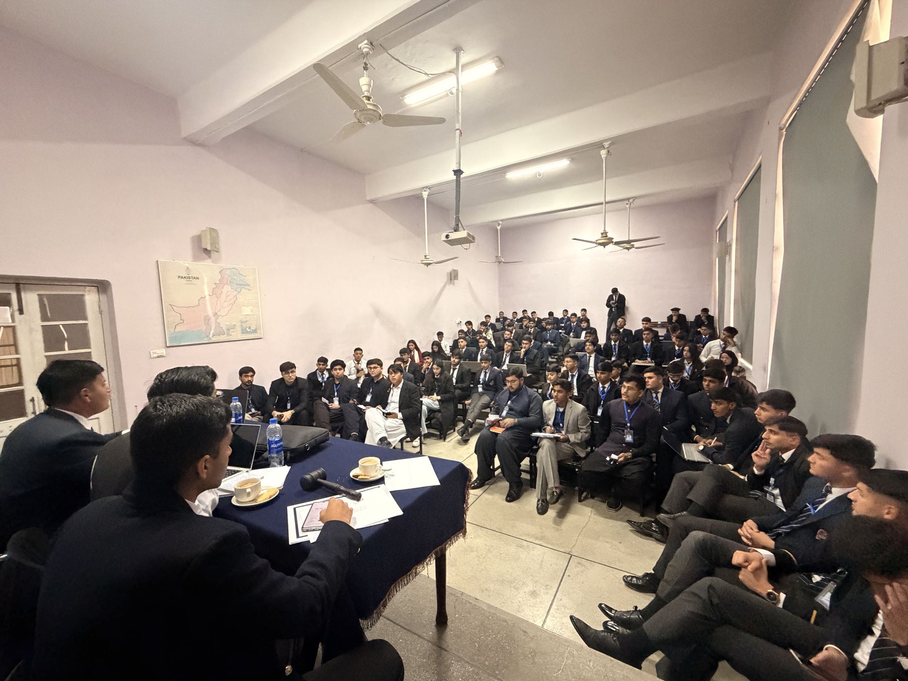 Delegates in session around the committee table